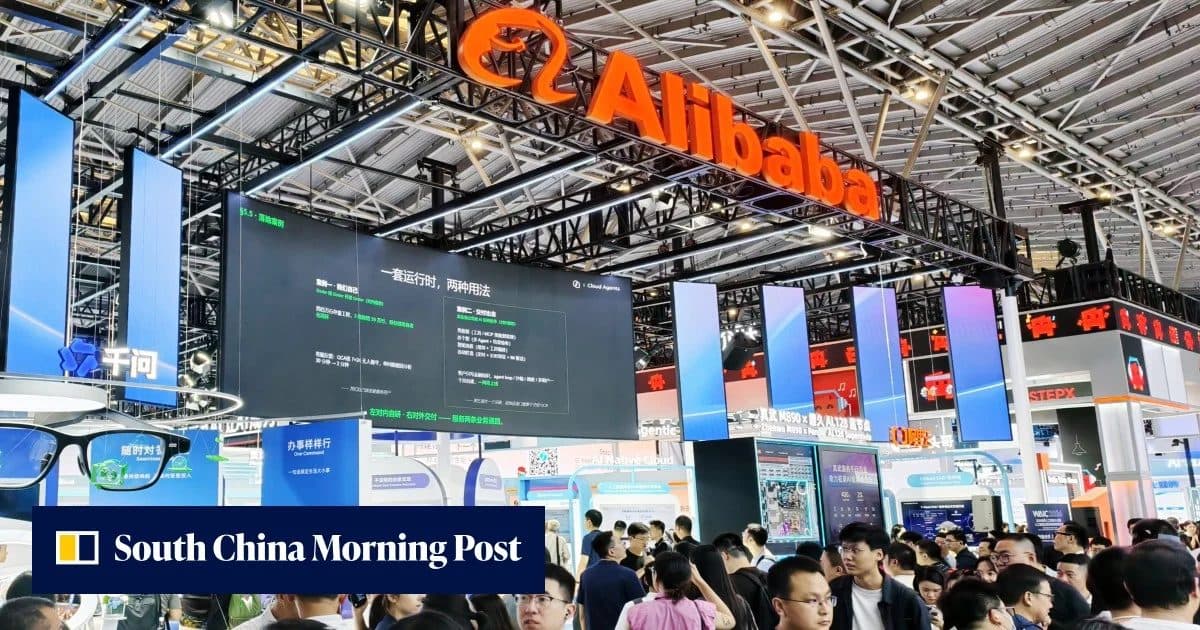 An Alibaba exhibition stand, the company's orange logo suspended above a crowded conference hall, watermarked South China Morning Post.