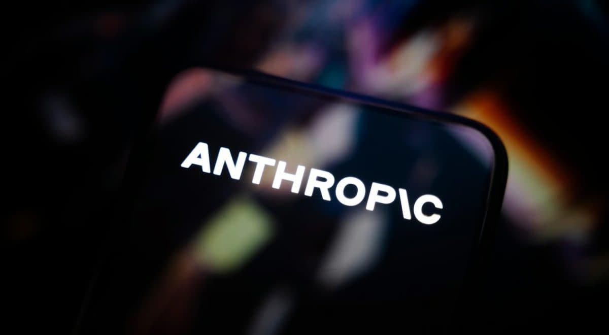 The Anthropic wordmark glowing on a smartphone screen