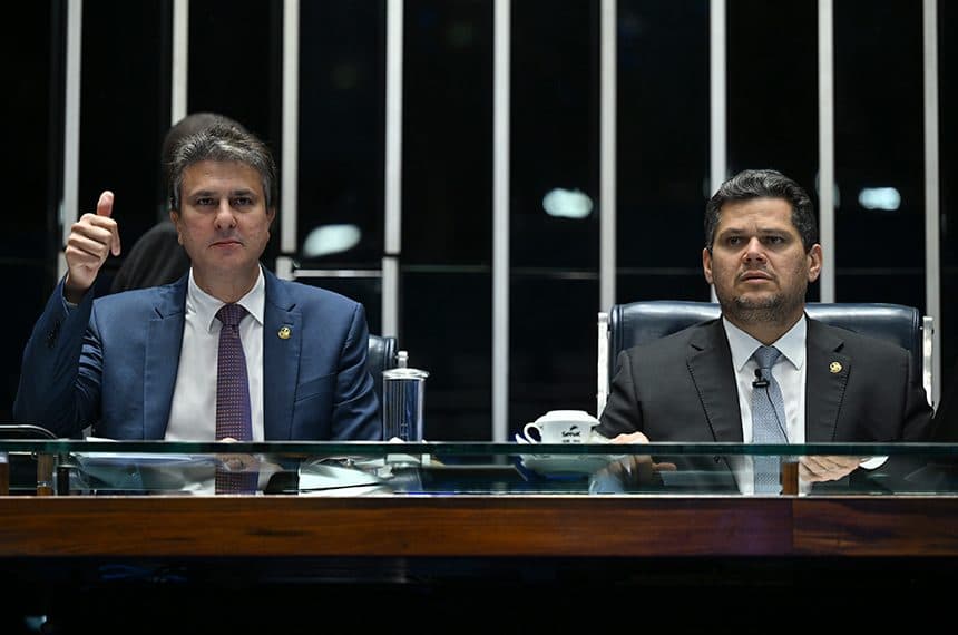 Two Brazilian senators seated at the chamber's presiding desk during the session, one gesturing while speaking