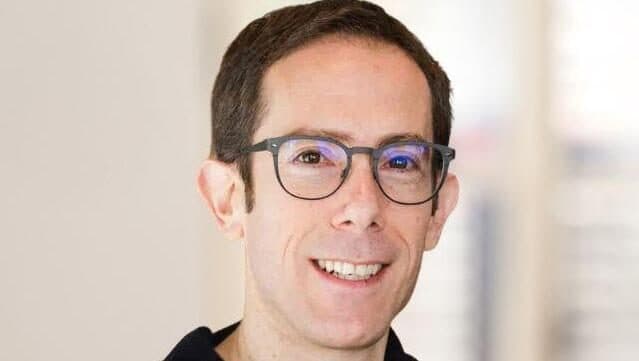 Headshot of a bespectacled man in a dark shirt, cropped from the 'Attribute founders' portrait Calcalist published with the acquisition report; the crop shows one of the company's two co-founders.