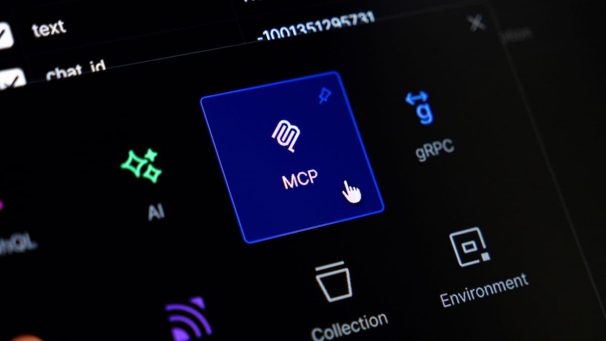 A dark developer interface photographed at an angle, a blue tile labelled MCP sitting among icons for AI, gRPC, Collection and Environment