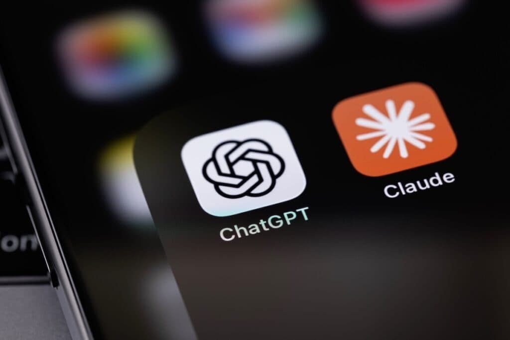A phone screen showing the ChatGPT and Claude app icons in close-up
